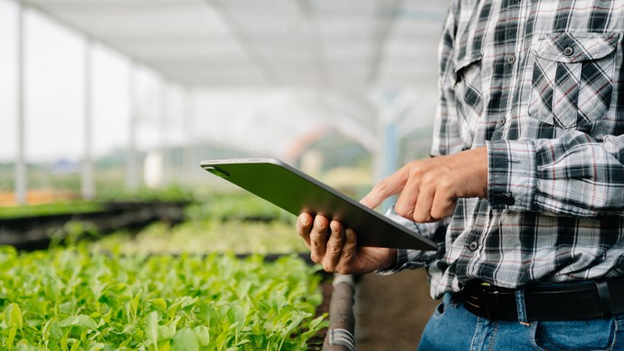 Man holding Ipad on farm.jpg