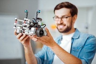 Man working to develop robot