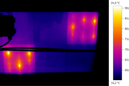 Thermal image showing varying heat levels in a rectangular area with bright orange spots indicating high temperatures, ranging from 55.2°C to 91.0°C, and a color scale on the right